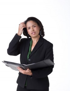 women scratching head looking confused