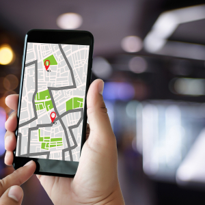 person holding iPhone showing a map