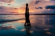 woman on beach at sunset doing headstand